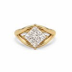 Gold ring with a princess-cut diamond on a white background