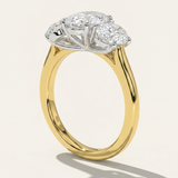 Side profile view of the MOHSTEN Sydney oval diamond trilogy engagement ring in 18ct yellow gold showcasing the architectural cathedral shoulder band and pinched wire gallery setting.