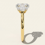 Side profile view of the MOHSTEN Sydney oval diamond trilogy engagement ring in 18ct yellow gold showcasing the high-polish comfort-fit band and the elegant three-stone setting architecture.
