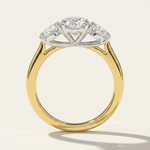 Through-finger view of the MOHSTEN Sydney oval diamond trilogy engagement ring highlighting the structural two-tone contrast between the 18ct yellow gold band and the platinum basket setting.