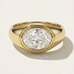 MOHSTEN Tova modern dome signet ring with bezel set oval diamond in yellow gold.