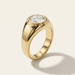 MOHSTEN Tova 18ct yellow gold signet ring with flush-set oval cut diamond.