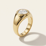 MOHSTEN Tova 18ct yellow gold signet ring with flush-set oval cut diamond.
