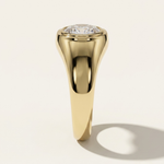 MOHSTEN Tova yellow gold thick band signet ring side profile with flush-set oval diamond.