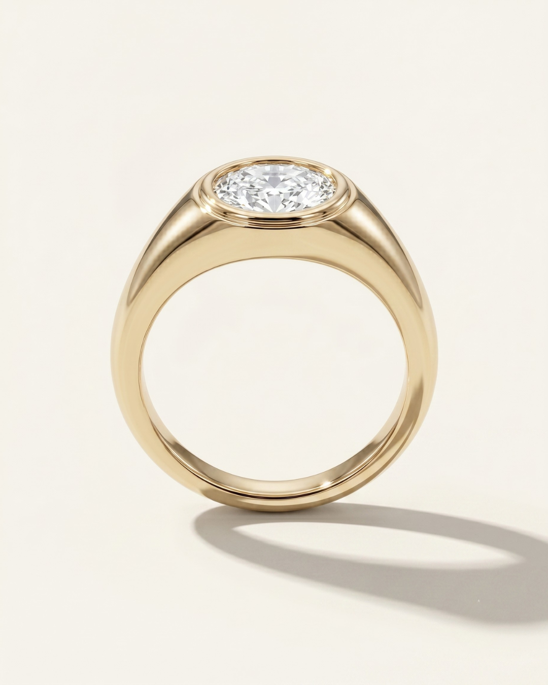 MOHSTEN Tova yellow gold signet ring with horizontal oval cut diamond.