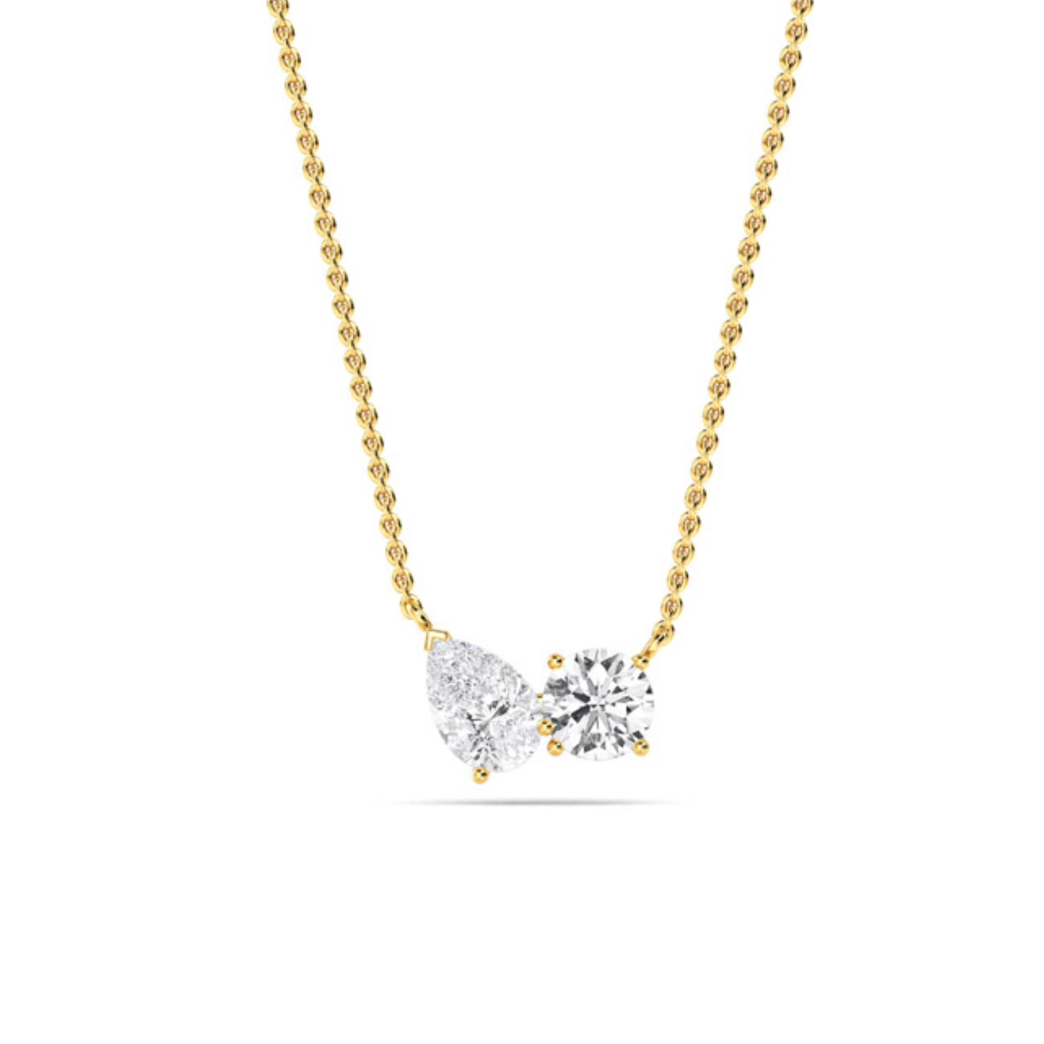 Diamond Duo Necklace featuring claw-set pear and round lab-grown diamonds spaced on a fine 18 ct gold chain, shown on white background