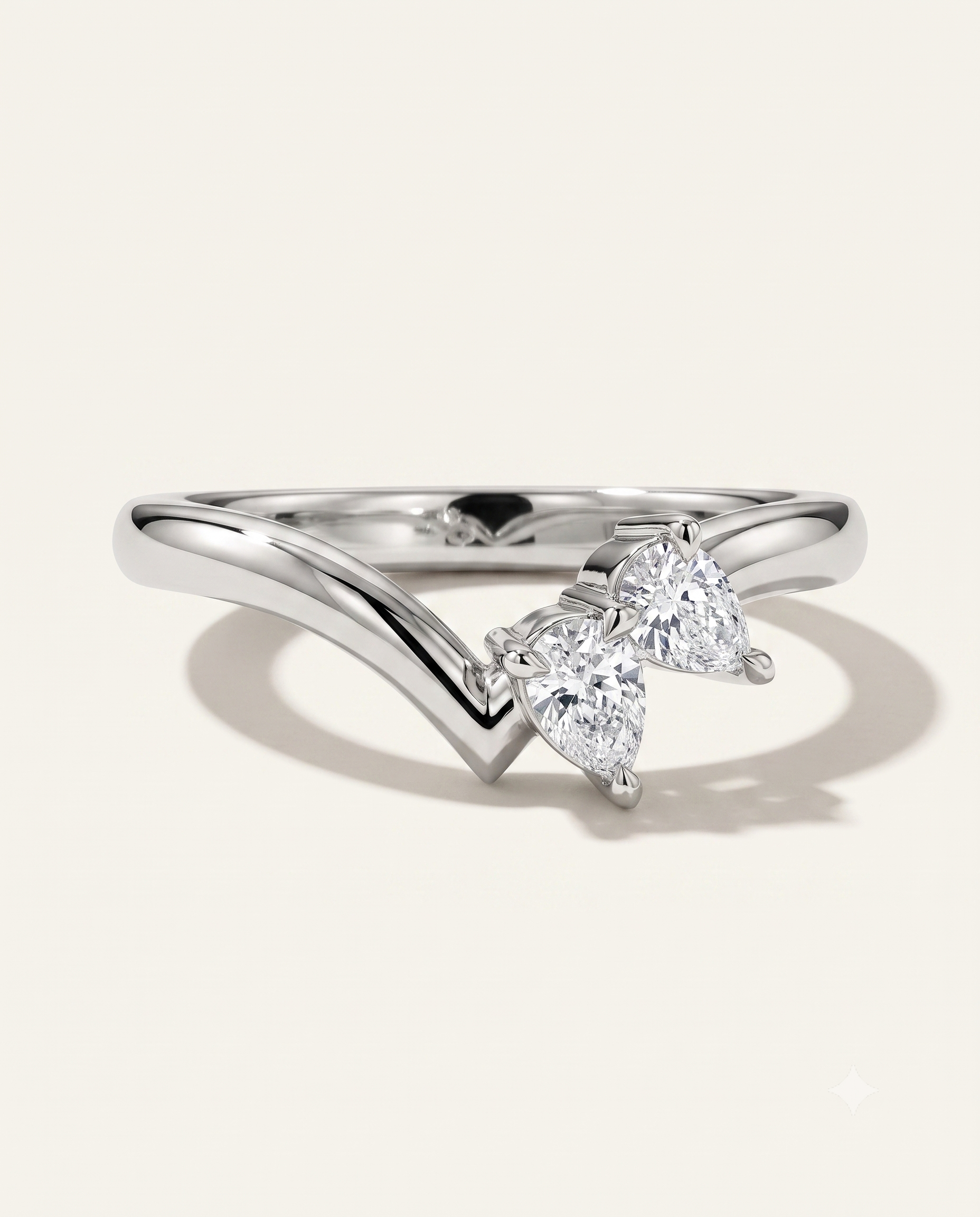 a white gold wishbone pear diamond wedding ring