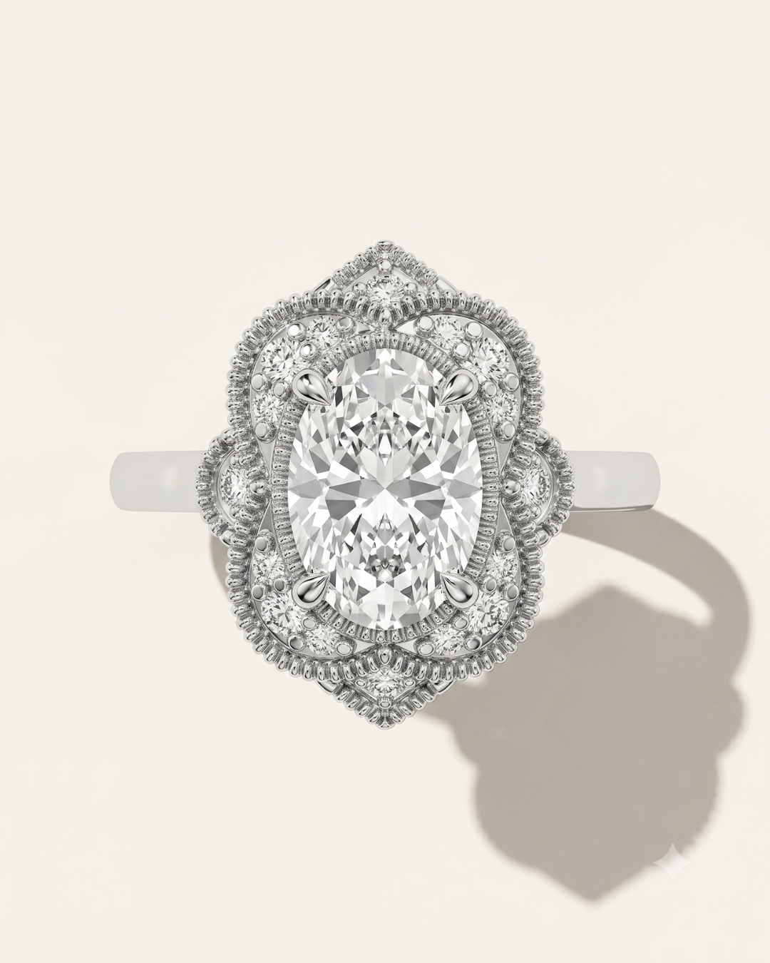 MOHSTEN The Capri vintage scalloped milgrain halo oval engagement ring in 18ct white gold.
