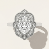 MOHSTEN The Capri vintage scalloped milgrain halo oval engagement ring in 18ct white gold.