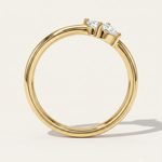 a yellow gold wedding ring with pear diamonds