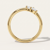 a yellow gold wedding ring with pear diamonds