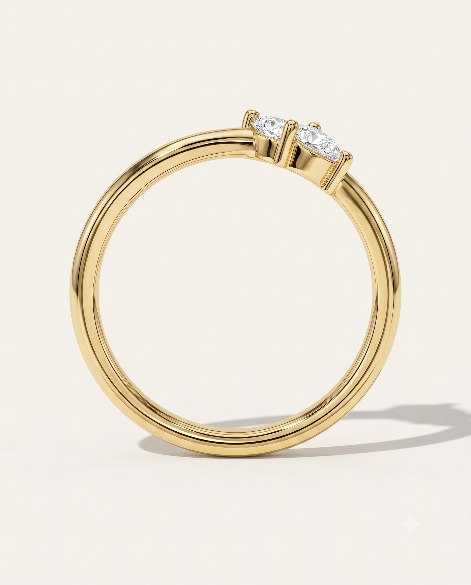 a yellow gold wedding ring with pear diamonds